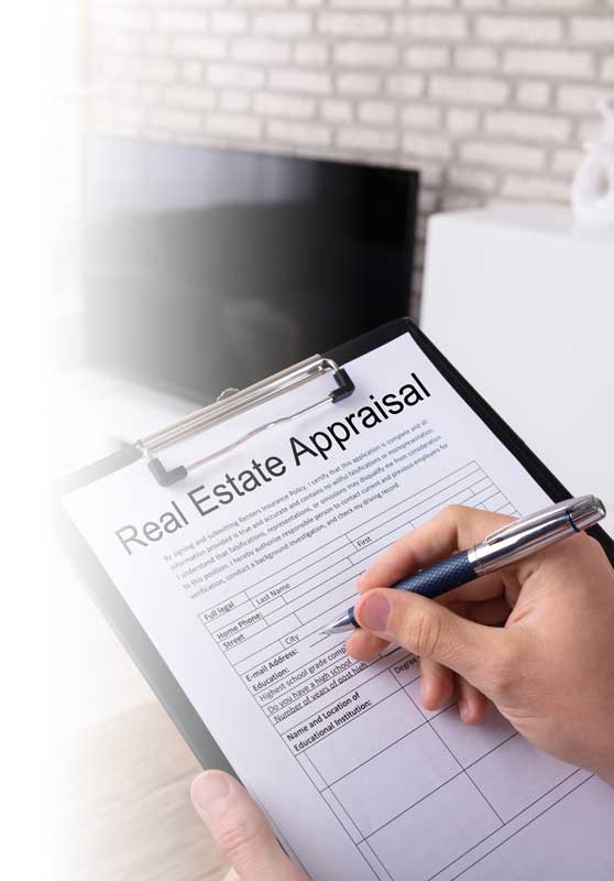 Man holding a clip board conducting a Real Estate Appraisal